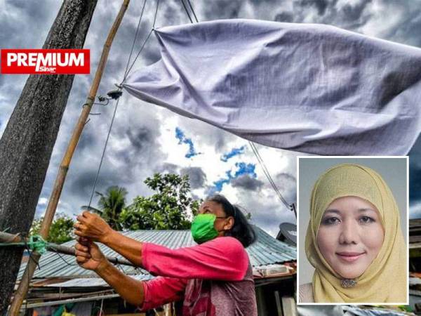 Nik Faizah (gambar kecil) menjadi individu pertama mencetuskan idea kempen bendera putih di media sosial pada penghujung Jun lalu.