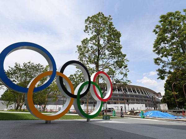 Media melaporkan terdapat 71 kes Covid-19 dikesan membabitkan temasya Sukan Olimpik Tokyo. - Foto AFP