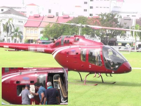 Kehadiran sebuah helikopter mendarat di Padang Ipoh pada pagi Jumaat dipercayai bagi mengambil pesanan 36 bungkus nasi ganja. -Foto: Astro Awani