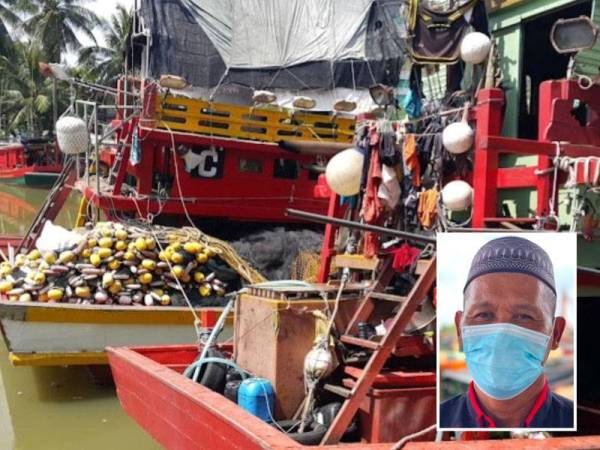 Bot para nelayan diletakkan di Jeti Kompleks Pendaratan Ikan Pengkalan Petah, Bachok selepas pulang dari menangkap ikan di laut. Gambar kecil: Mohd Saripundin Isahak