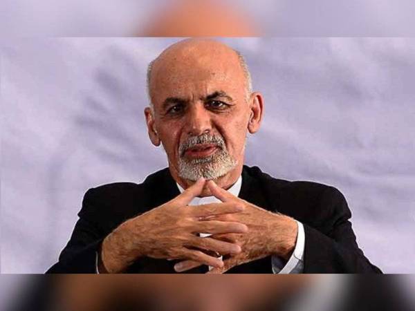 Gambar kecil: Ashraf Ghani. - Foto AFP