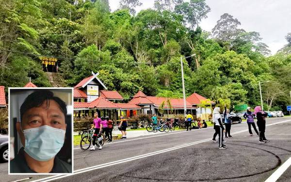 Kelihatan kumpulan berbasikal dan pendaki berehat di kaki Gunung Angsi di Kuala Pilah pada Ahad. Gambar kecil: Saleh Awaluddin