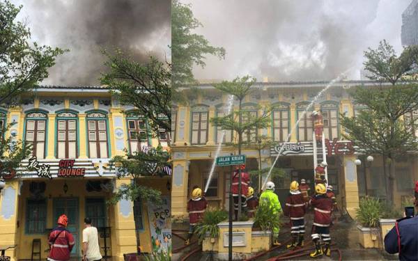 Anggota bomba melakukan kerja-kerja memadam kebakaran di tempat kejadian.