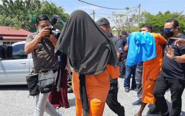 Tertuduh ketika di bawa ke Mahkamah Majistret Port Dickson pada Isnin.