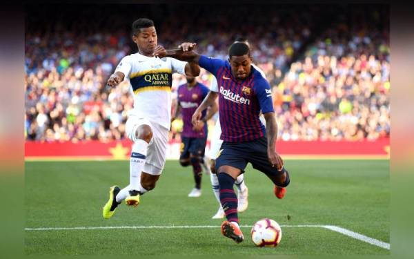 Aksi Barcelona dan Boca Juniors pada aksi merebut Piala Joan Gamper. - Foto gettyimages