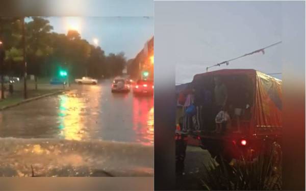 Anggota bomba membantu memindahkan mangsa banjir dari Kampung Kempadang di sini selepas kawasan itu dinaiki air ekoran hujan lebat berterusan sejak Khamis.