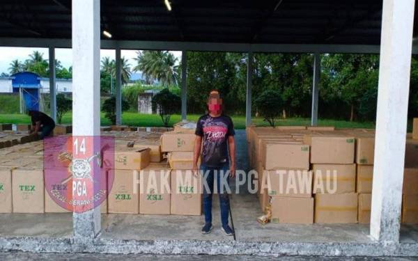 PGA rampas 362,600 bungkus rokok seludup dianggarkan bernilai RM8.69 juta selepas menahan sebuah lori dipandu seorang lelaki. - Foto FB Batalion 14 PGA Tawau