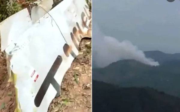 Kebakaran turut tercetus di kawasan gunung setelah pesawat itu terhempas di daerah Teng berhampiran Wuzhou di wilayah Guangxi. - Foto Agensi