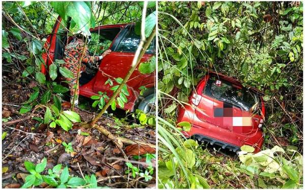 Keadaan kereta yang dipandu seorang wanita yang terjatuh ke dalam gaung di Jalan Kuala Dong ke Batu Malim, Raub pada Rabu. Foto: Ihsan JPBM