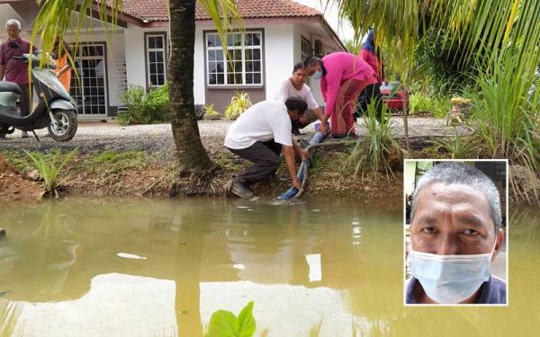 Penduduk terpaksa mengepam air bertakung dan mengalirkan ke kawasan lain bagi mengelakkan banjir lebih buruk. Gambar kecil: Yusnizan