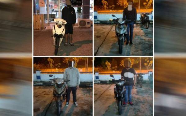 Empat penunggang motosikal yang ditahan polis selepas dikesan melakukan aksi berbahaya di Lebuh Raya Kuala Lumpur - Seremban pada Khamis.