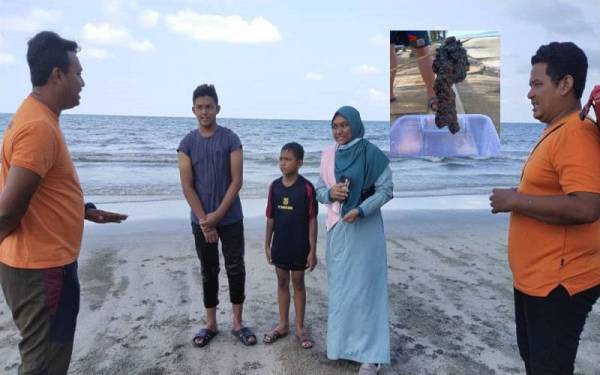 Wan Mohd Harith Firdaus (kiri) menjelaskan kepada Fatonah dan adiknya, Amir Aiman tentang kehadiran obor-obor di pantai itu dan menasihatkan mereka supaya tidak mandi bagi mengelak kejadian tidak diingini.