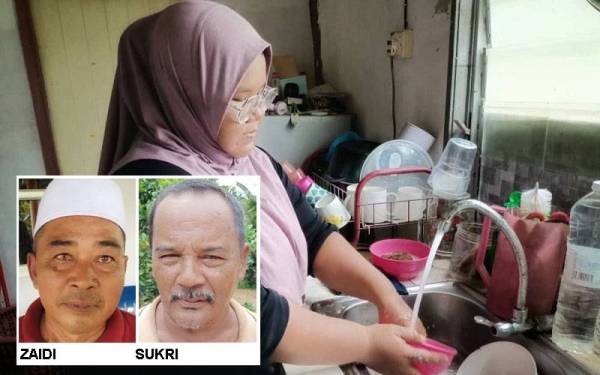 Siti Noor Hidayu membasuh pinggan mangkuk di rumahnya setelah bekalan air pulih seperti sedia kala.