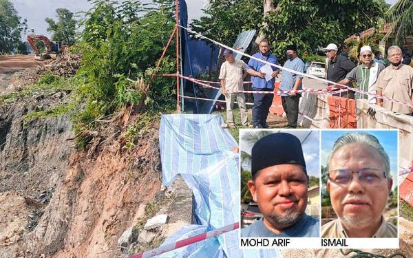 Muhammad Ahyad (dua dari kiri) melihat keadaan tanah runtuh yang berlaku di Jalan Sri Raya 4, Taman Ayer Keroh Heights, Melaka pada Selasa.