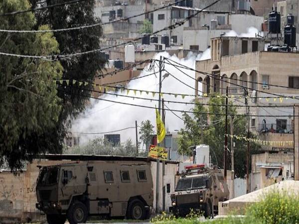 Kenderaan pasukan keselamatan Israel bergerak dekat sebuah kem pelarian Palestin di Jenin, Tebing Barat baru-baru ini. - Foto AFP