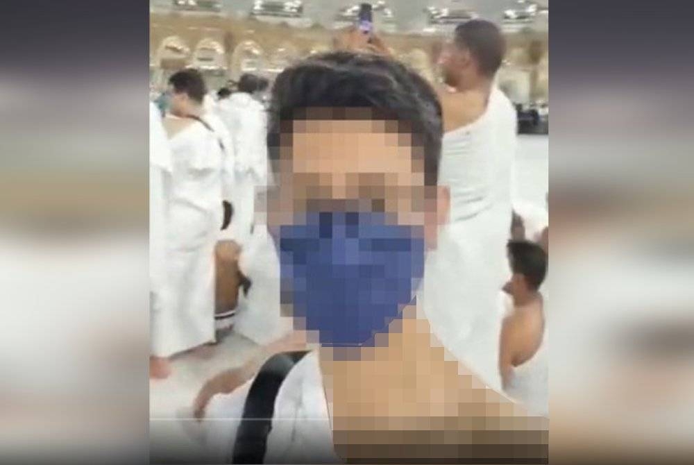 Tangkap layar video tular menunjukkan seorang individu dipercayai wanita dari Malaysia yang menunaikan umrah dengan memakai ihram.