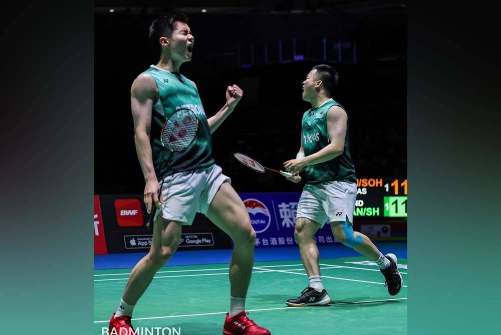 Aaron Chia-Soh Wooi Yik berjaya merangkul gelaran Juara Dunia BWF World Championships 2022. - Foto: Badminton Photo