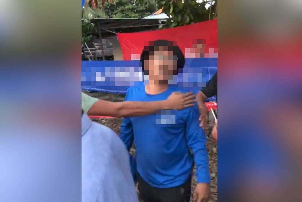 Antara salah seorang penyokong yang didakwa datang membuat kacau semasa program sembang santai di Sungai Dulang, petang Ahad.