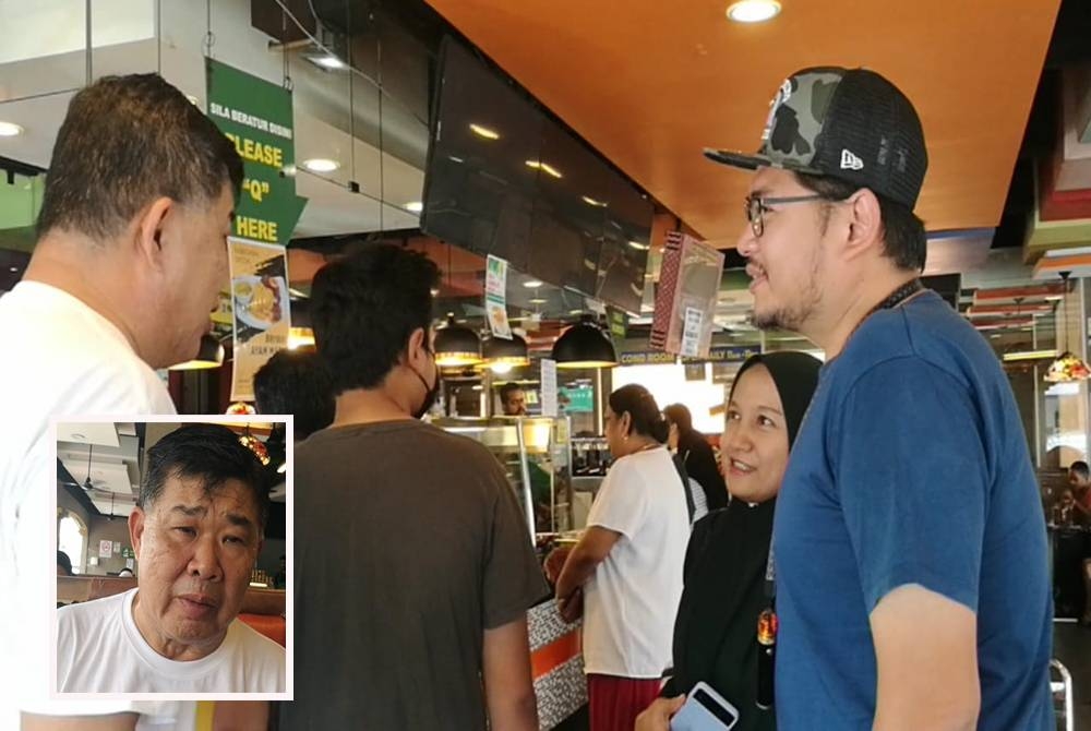 Chee Heng (kiri) ketika bertemu rakyat di sekitar Puchong pada Jumaat.