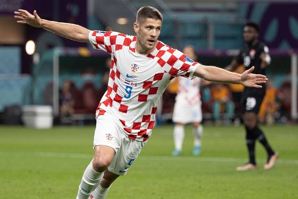 Andrej Kramaric meledak dua gol ketika membantu Croatia menewaskan Kanada dalam perlawanan kedua Kumpulan F menentang Croatia di Stadium Antarabangsa Khalifa. FOTO: EPA