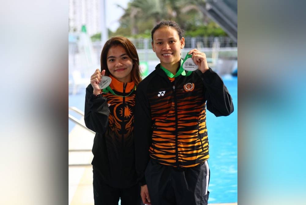 Nur Dhabitah (kiri) dan Pandelela Rinong.