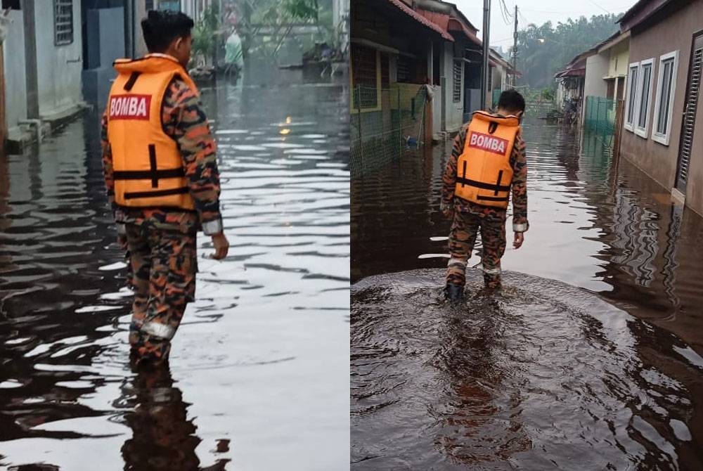 Anggota bomba menjalankan pemantauan di lokasi banjir kilat di Taman Meru Jaya, Jalan Kassim, Meru di sini pada Selasa.