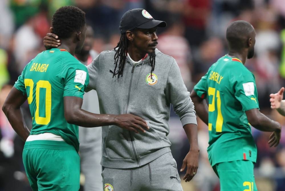 Cisse (tengah) dan Senegal meraih pengalaman berguna di pentas Piala Dunia Qatar 2022. - Foto EPA