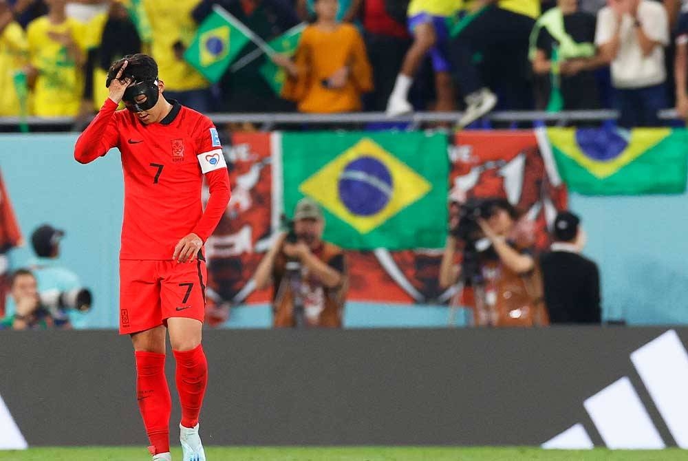 Reaksi Heung-min selepas perlawanan pusingan 16 Piala Dunia Qatar 2022 antara Brazil dan Korea Selatan di Stadium 974, Doha. Foto: EPA