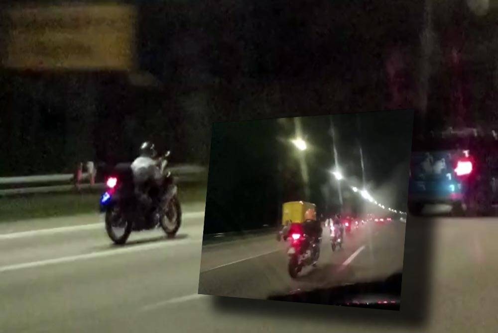 Aksi 'Superman' yang dikesan dilakukan kumpulan penunggang motosikal di Lebuhraya Kuala Lumpur-Seremban, pada Khamis.