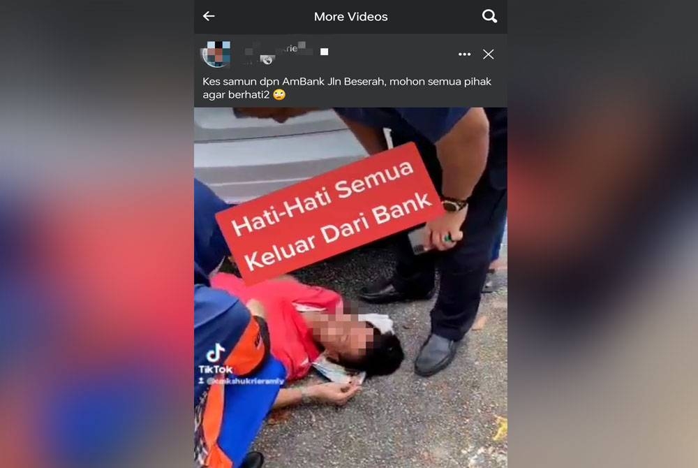 Tangkap layar video seorang lelaki terbaring selepas disamun di hadapan sebuah bank di Jalan Beserah pada Selasa yang tular di media sosial.