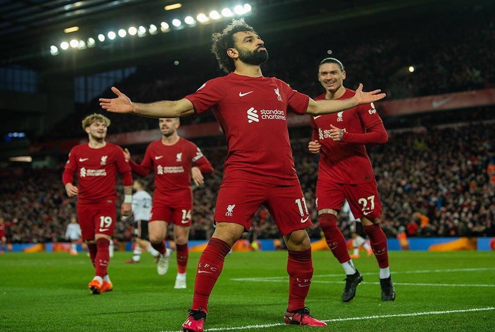 Salah (depan) meledak dua gol ketika membantu Liverpool mengalahkan United 7-0 di Anfield pada Isnin. - Foto EPA