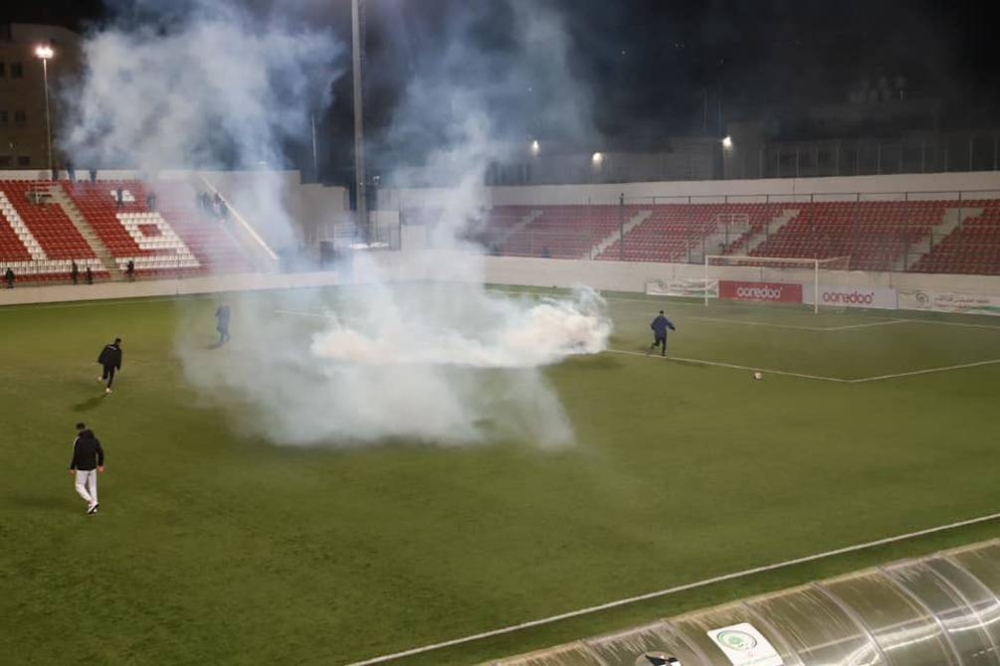 Gas pemedih mata dilepaskan tentera Israel ketika perlawanan akhir Piala Abu Ammar, Balata FC menentang Jabal Al Mukabber di Stadium Antarabangsa Faisal Al Husseini, al-Ram. - Foto Agensi