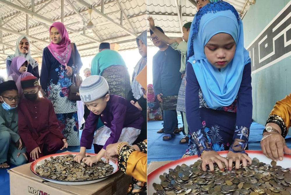 Masjid Kariah Desa Anggerik buat kelainan beri duit raya dalam dulang. - Foto ihsan orang awam