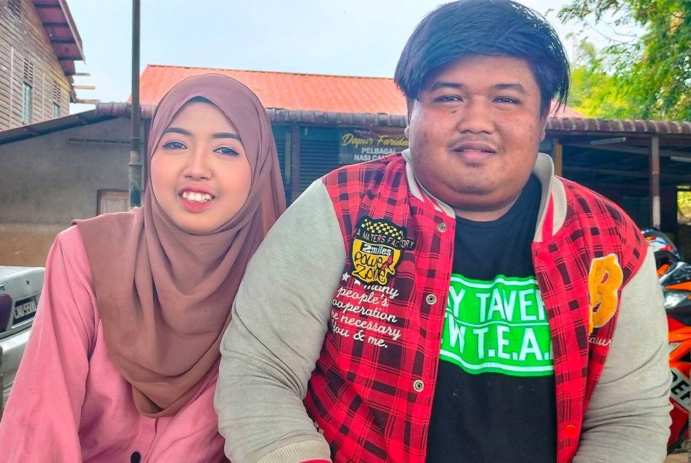 Izzati bersama abangnya, Amirul yang banyak memberikan sokongan.