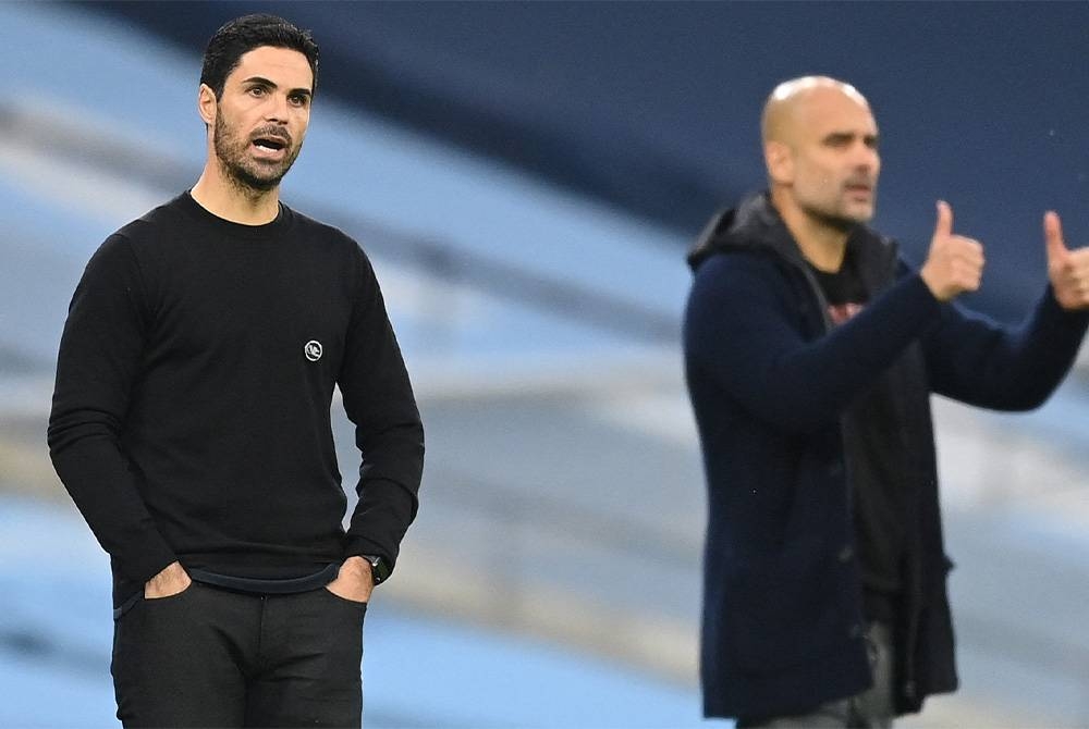 Arteta (kiri) dan Guardiola menjadi tumpuan dalam perlawanan Liga Perdana Inggeris di Stadium Etihad. FOTO: AFP