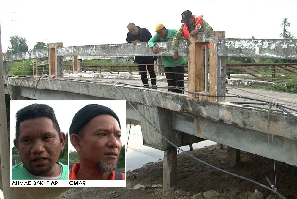 MD Shah (dua dari kiri) melihat keretakan serius di jambatan berusia lebih 15 tahun di jeti Pangkalan Nelayan Serkam Pantai.