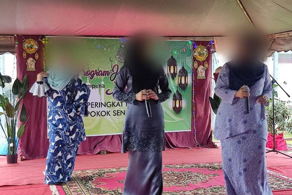 Penghuni wanita Penjara Pokok Sena membuat persembahan pada program Jalinan Kasih Aidilfitri Penjara Pokok Sena pada Isnin.