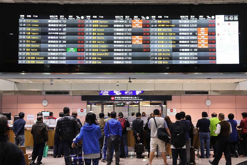 TAIPEI, TAIWAN - NOVEMBER 22, 2018: People wait at Taoyuan International Airport near Taipei, Taiwan. It is Taiwan&#039;s largest and busiest airport.