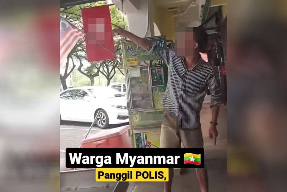 Tangkap layar kejadian dipercayai seorang lelaki warga Myanmar bertindak memarahi anggota polis.