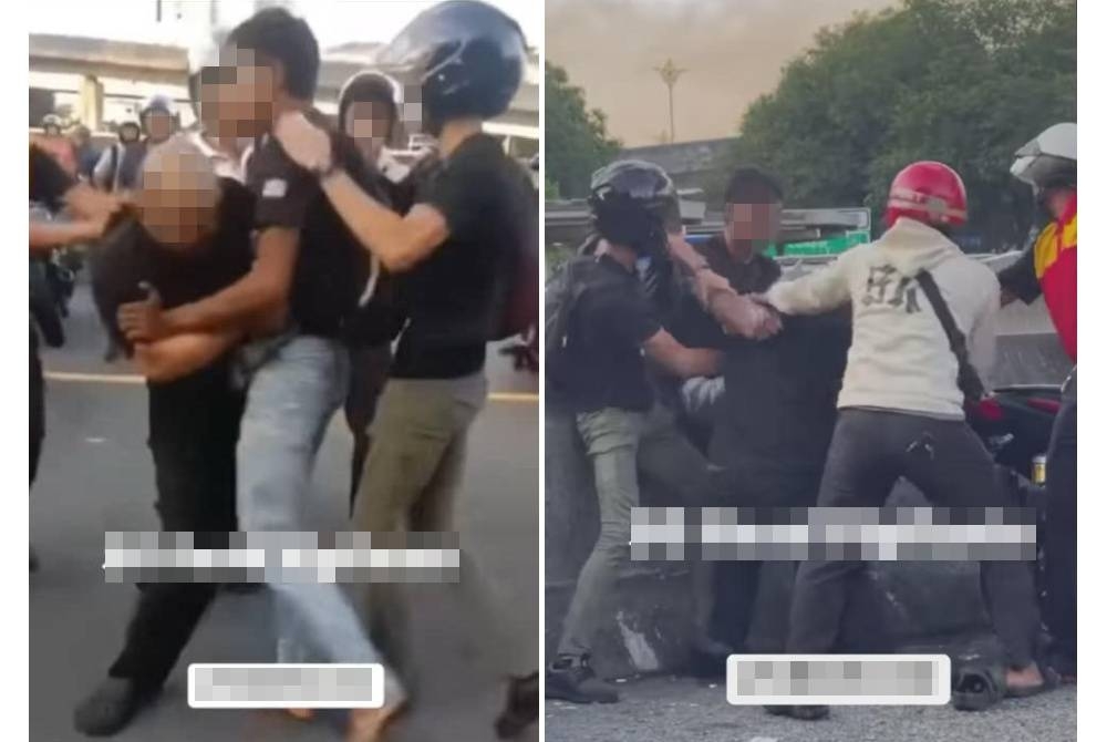 Tangkap layar sebuah video yang tular memaparkan dua lelaki bergaduh di CIQ BSI, Johor Bahru selepas motosikal mereka bergesel.