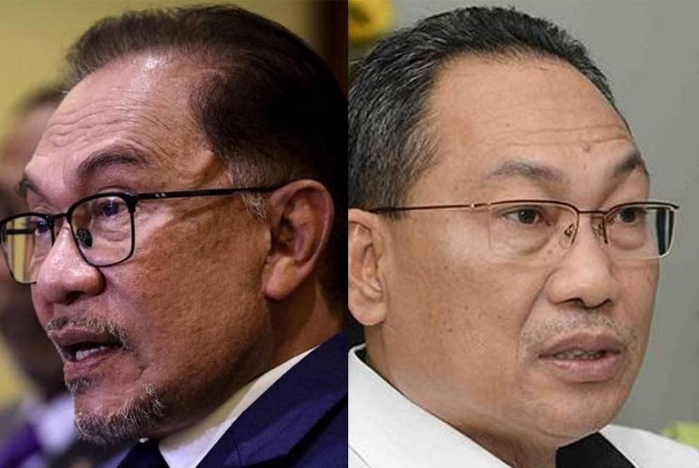 Anwar Ibrahim (kiri), Awang Solahuddin Hashim (kanan).