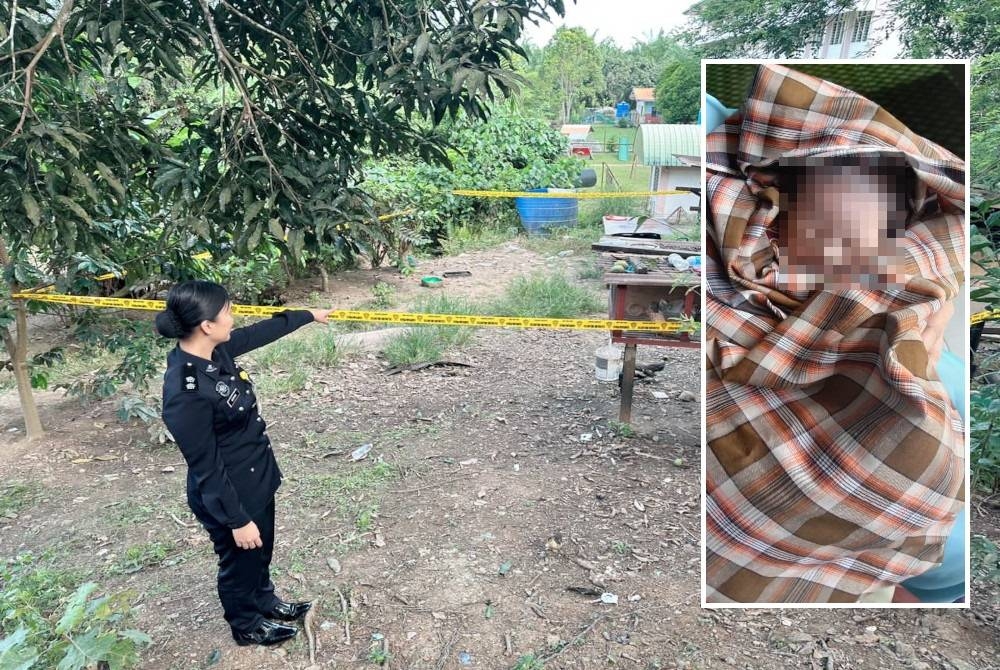 Pegawai polis menunjukkan lokasi bayi (Gambar kecil) itu ditemui di atas reban ayam di Kampung Jawa, Lahad Datu pada Isnin.