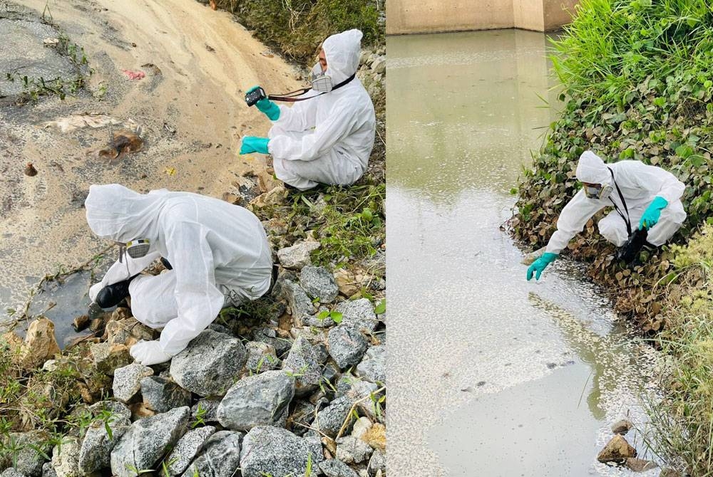 Pihak HAZMAT dan JAS melakukan ujian kandungan air di sebuah parit berdekatan sebuah kilang yang dicemari sisa buangan di Kawasan Perindustrian Maju Jaya, Kempas, Johor Bahru, pada Selasa.