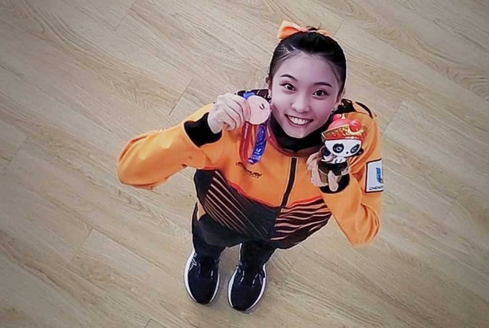 Mandy bersama pingat gangsa dimenangi menerusi acara tajiquan Universiade edisi ke-31 di Chengdu sebentar tadi. FOTO: KPT