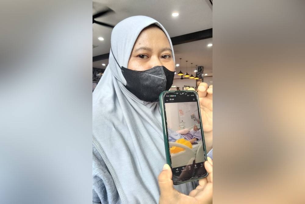 Zuraidah menunjukkan keadaan Nurul Aqilah yang kini dirawat di HRPZII.