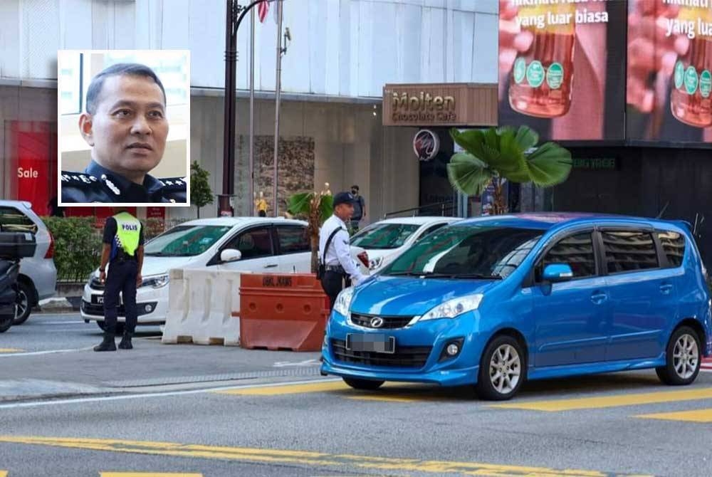 Pengguna jalan raya yang memberhentikan kenderaan melebihi garisan putih boleh dikenakan tindakan penjara dan denda. (Gambar kecil: Mohd Nasri)