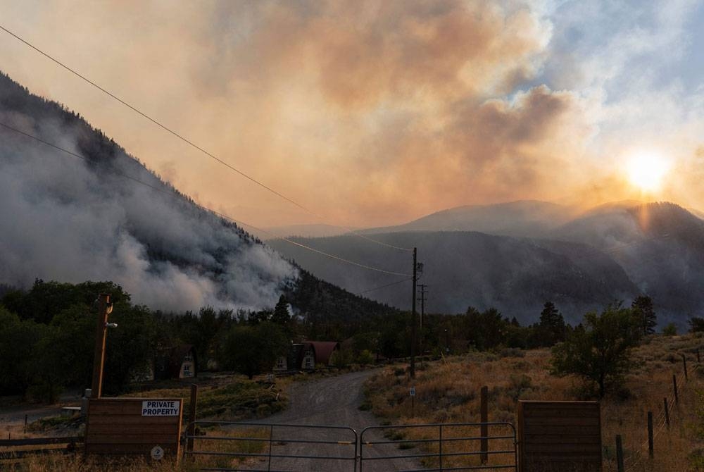 Darurat telah diisytiharkan di wilayah British Columbia Kanada ketika kebakaran hutan yang dahsyat terus melanda wilayah itu pada Jumaat. - Foto AFP