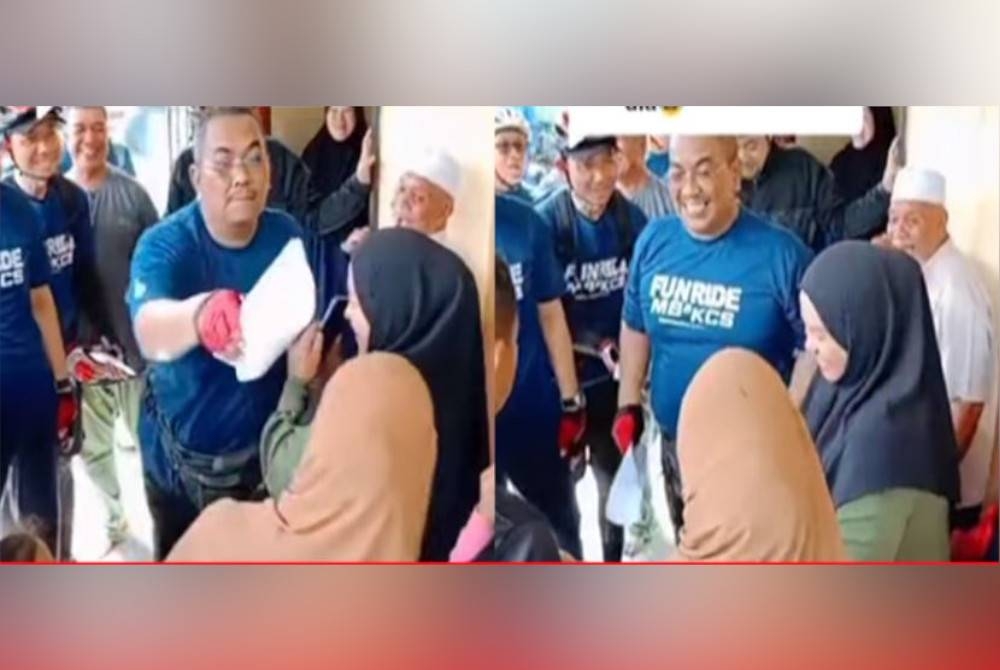 Video tular Sanusi bergurau mengetuk kepala seorang wanita muda dengan kertas.