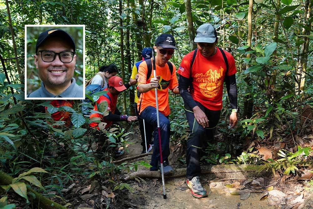 Salah seorang malim gunung (kanan) membantu peserta OKU mendaki Bukit Kerinchi. - FOTO :MOHD HALIM ABDUL WAHID (Gambar kecil: Aby)