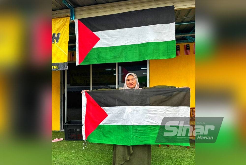 Suriani bersama bendera Palestin yang mendapat sambutan menggalakkan orang ramai.